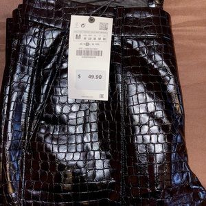 New Faux Leather pants w/front slit on the bottom.